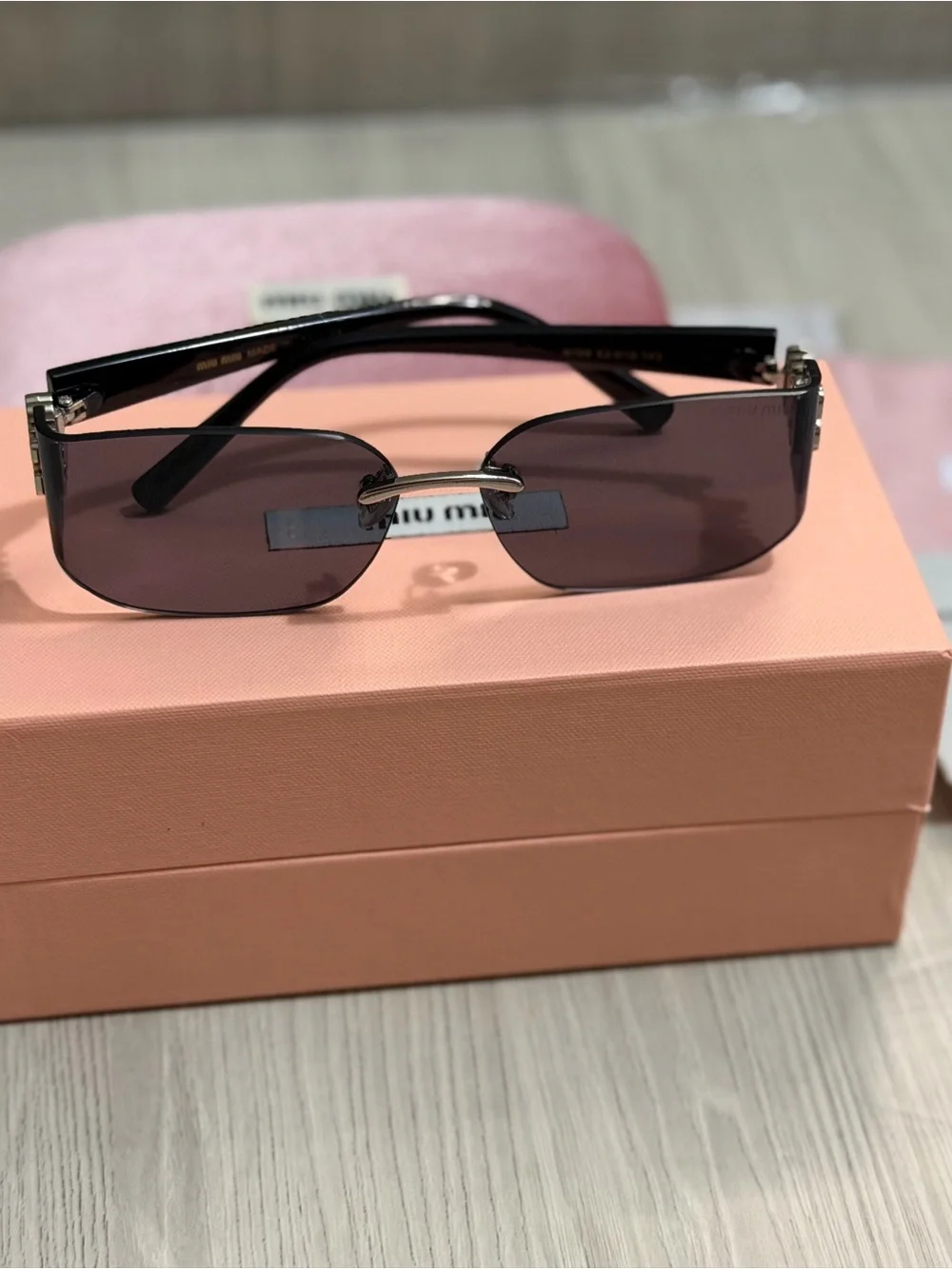 Miu Miu Slim Rectangular Sunglasses in Plum Tint